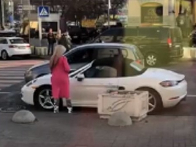 Подробности истории блондинки с топором и Porsche в Киеве: автомобиль исчез